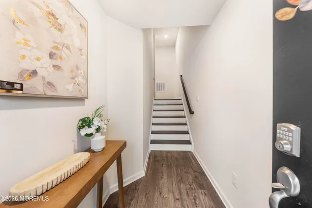 a view of entryway with wooden floor