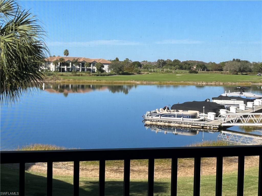 8771 Coastline Court, Unit 201 Naples, FL 34120 - Photo 1 of 49 a view of a lake with a city view