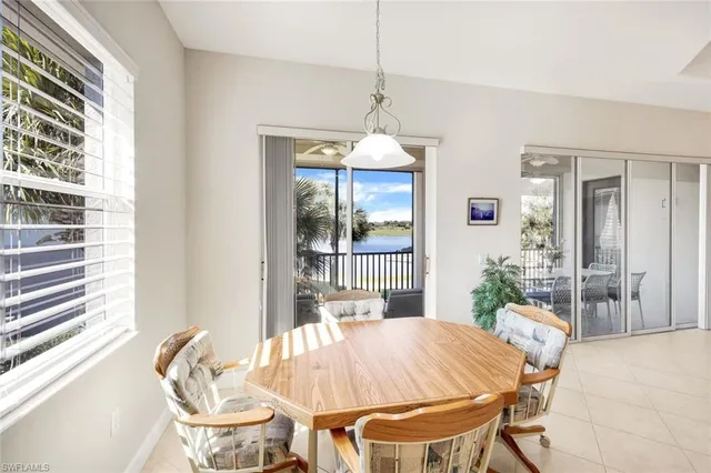 a dining room with a table and chairs
