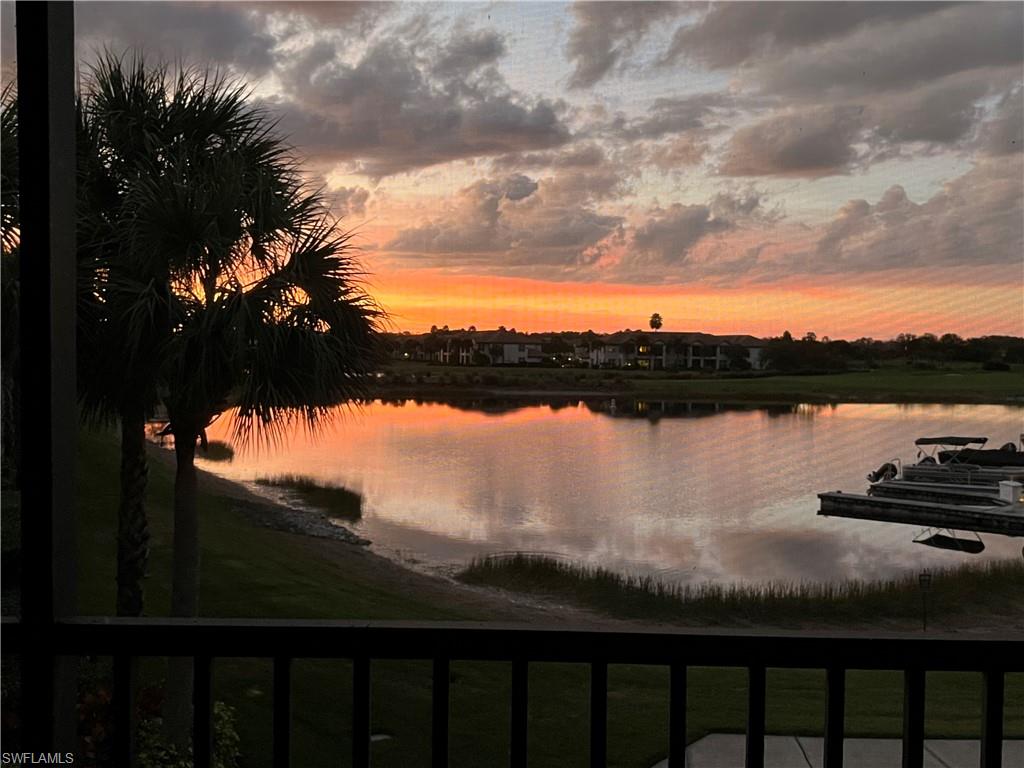 8771 Coastline Court, Unit 201 Naples, FL 34120 - Photo 2 of 49 a view of a lake from a balcony