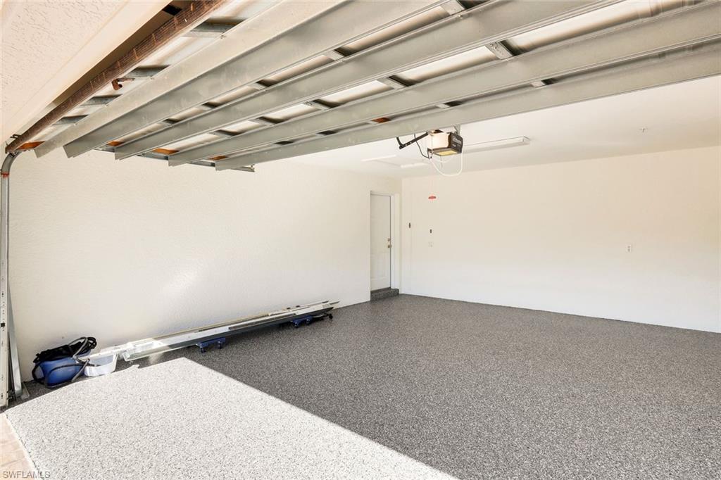 8771 Coastline Court, Unit 201 Naples, FL 34120 - Photo 28 of 49 a view of a room with racks and dryer