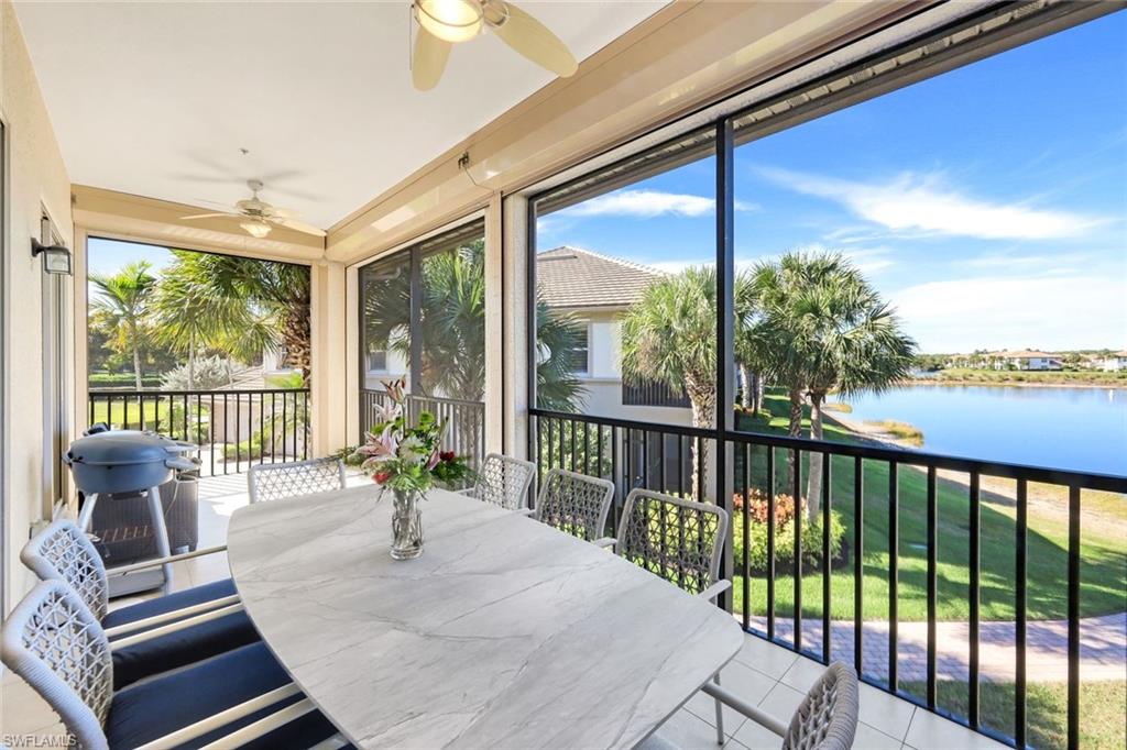 8771 Coastline Court, Unit 201 Naples, FL 34120 - Photo 30 of 49 a living room with furniture and a large window