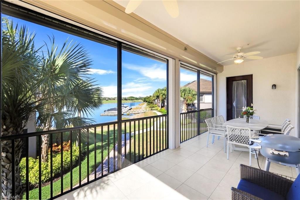 8771 Coastline Court, Unit 201 Naples, FL 34120 - Photo 30 of 49 a view of a chairs and tables in the balcony