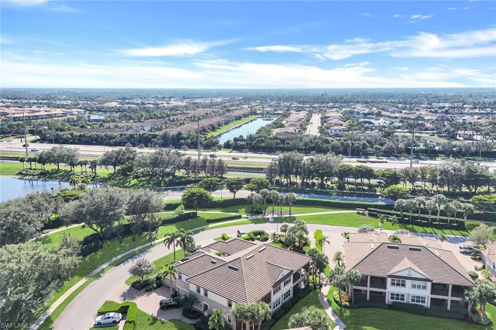8771 Coastline Court, Unit 201 Naples, FL 34120 - Photo 34 of 49 a view of a city with a lake view