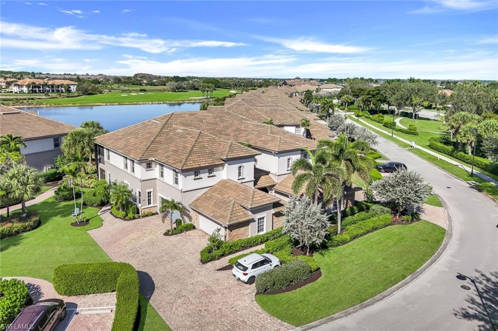 8771 Coastline Court, Unit 201 Naples, FL 34120 - Photo 4 of 49 an aerial view of residential houses with outdoor space and street view