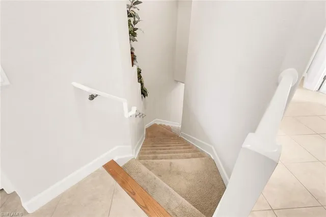 a view of staircase with white walls