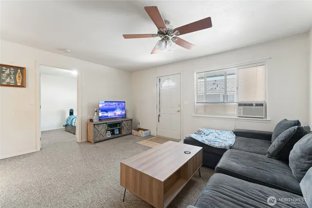 a living room with furniture and a window