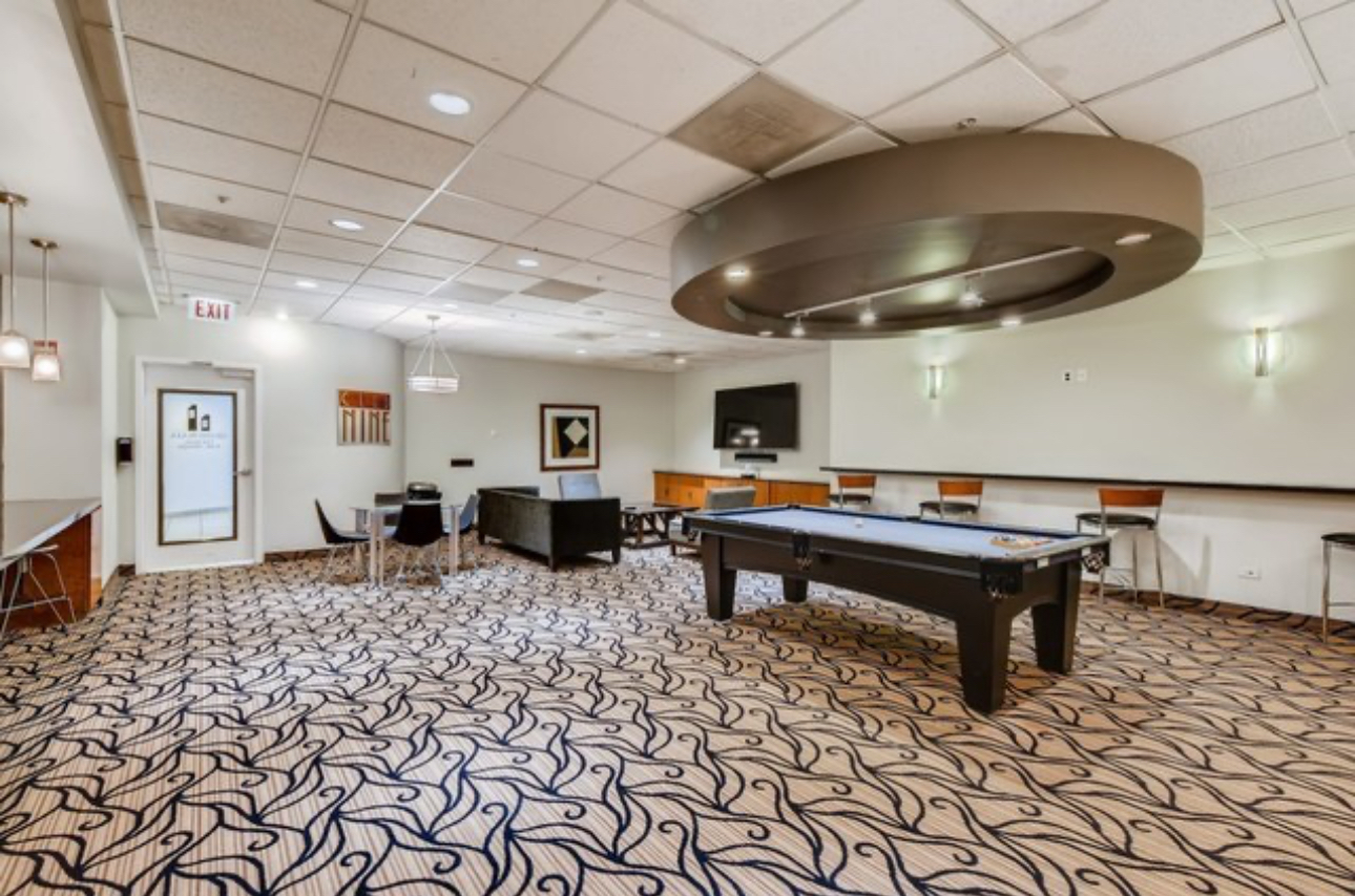 545 North Dearborn Street, Unit 2510 Chicago, IL 60654 - Photo 32 of 37 a gaming hall with a table and chairs