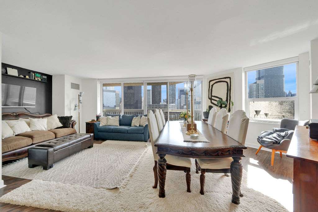 545 North Dearborn Street, Unit 2510 Chicago, IL 60654 - Photo 5 of 37 a living room with furniture and a flat screen tv