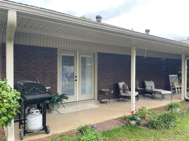 a garden view with a outdoor seating