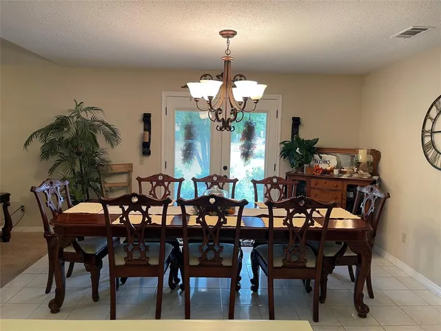 a view of a dining room and chandelier