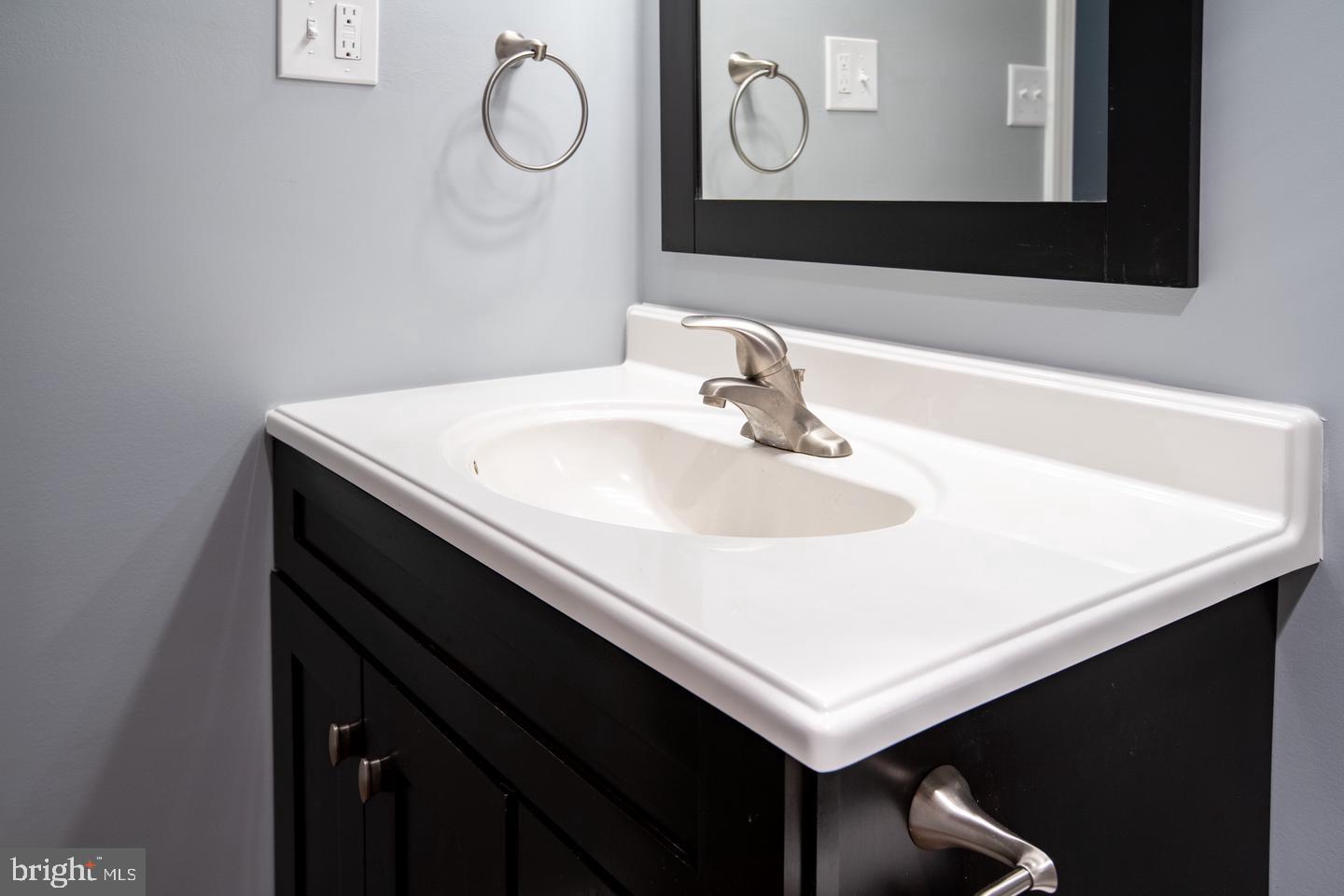 188 Old Forge Crossing, Unit 188 Devon, PA 19333 - Photo 15 of 19 a bathroom with a sink vanity and a mirror