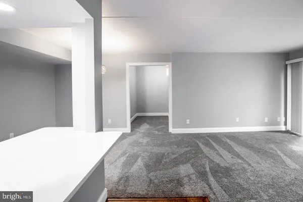 a view of a big room with closet and mirror