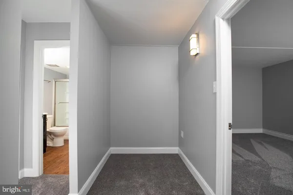 a view of a bathroom from the hallway