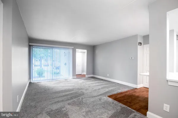 a view of an empty room and window