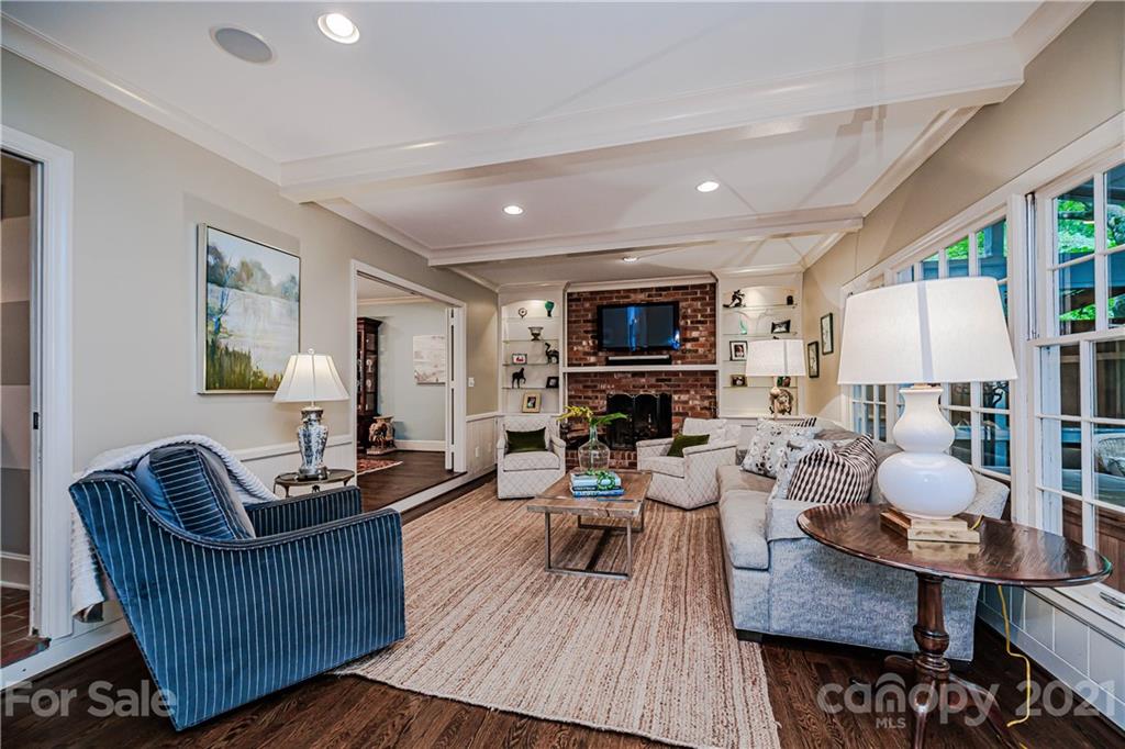 3800 River Ridge Road Charlotte, NC 28226 - Photo 14 of 48 a living room with furniture a fireplace and a flat screen tv