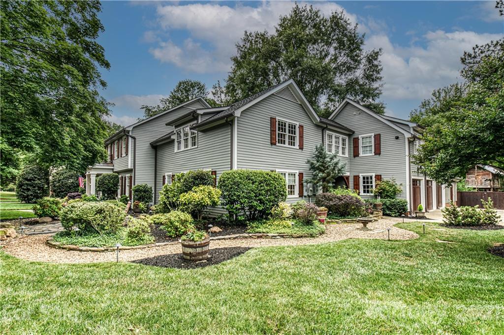 3800 River Ridge Road Charlotte, NC 28226 - Photo 3 of 48 a front view of a house with a yard