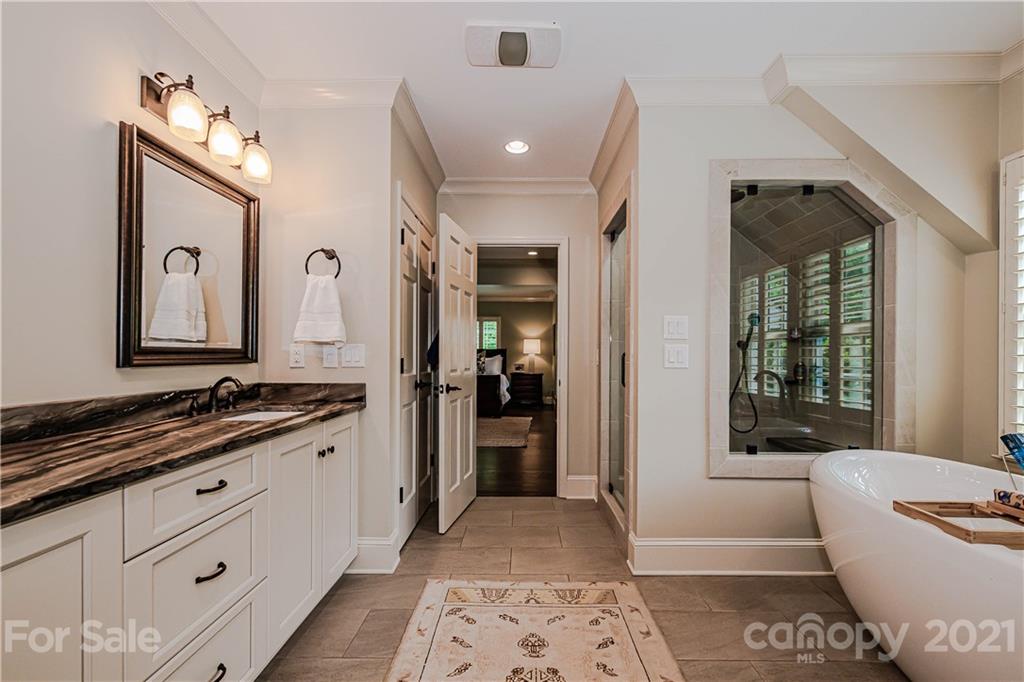 3800 River Ridge Road Charlotte, NC 28226 - Photo 22 of 48 a bathroom with a tub sink and mirror