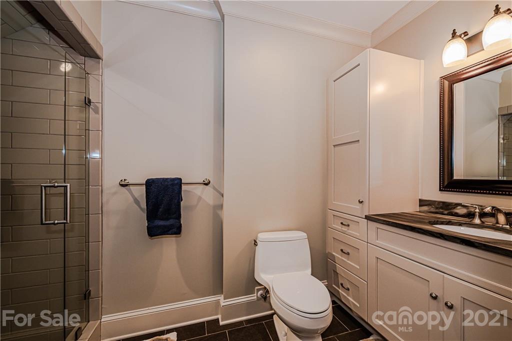 3800 River Ridge Road Charlotte, NC 28226 - Photo 26 of 48 a white toilet sitting next to a bathroom sink