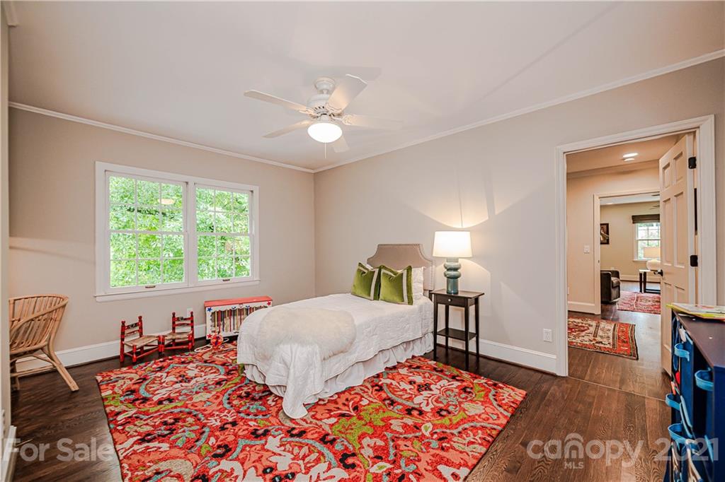 3800 River Ridge Road Charlotte, NC 28226 - Photo 31 of 48 a bedroom with a bed and wooden floor