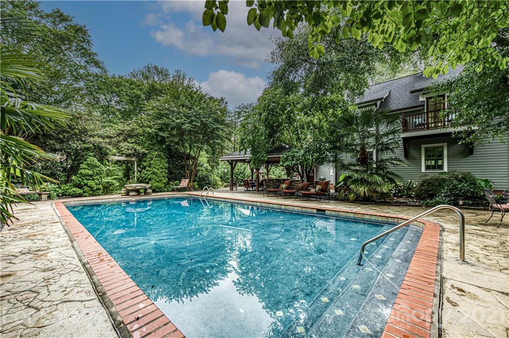 3800 River Ridge Road Charlotte, NC 28226 - Photo 38 of 48 a view of a swimming pool with a patio