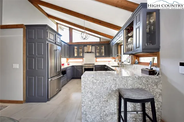 a view of a kitchen with furniture and a window