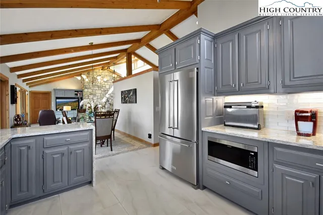 a kitchen with a sink cabinets and stainless steel appliances