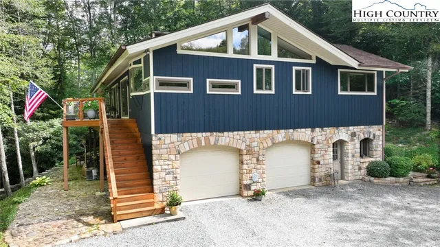 a front view of a house with a garage
