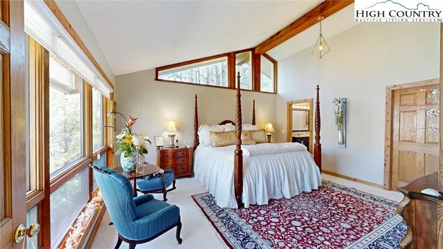 a bed room with a bed and a window