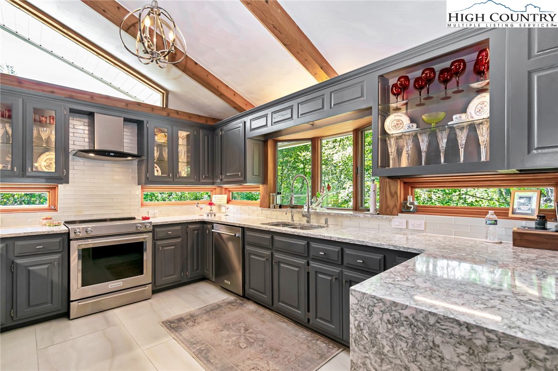 505 Tanglewood Cemetery Road Linville, NC 28646 - Photo 3 of 47 a kitchen with stainless steel appliances granite countertop a sink and window