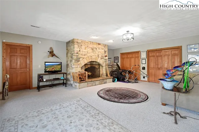 a view of a livingroom with furniture and a ceiling fan