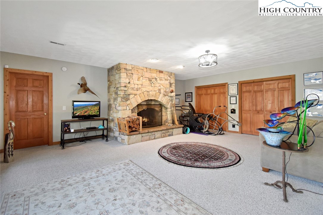 505 Tanglewood Cemetery Road Linville, NC 28646 - Photo 34 of 47 a view of a livingroom with furniture and a ceiling fan