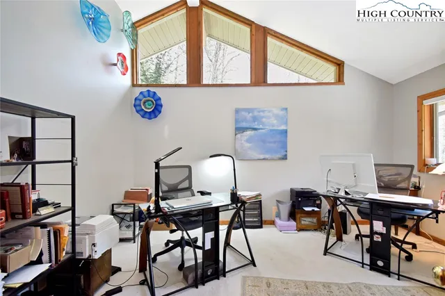 a view of a workspace with furniture and toys