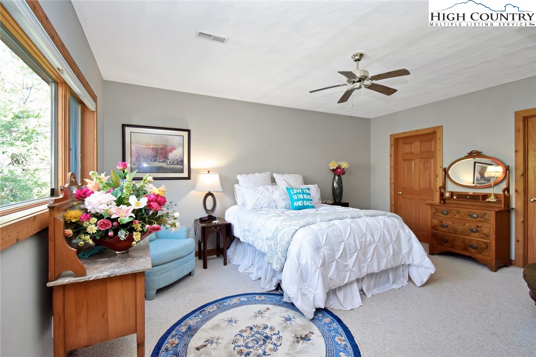 505 Tanglewood Cemetery Road Linville, NC 28646 - Photo 38 of 47 a bedroom with bed and a window