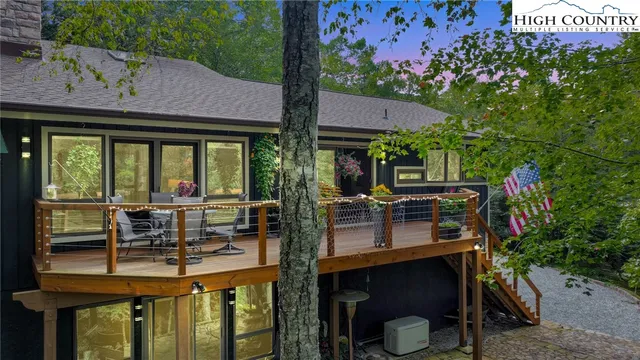 a view of house with outdoor seating and city view