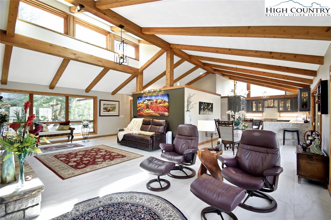 505 Tanglewood Cemetery Road Linville, NC 28646 - Photo 7 of 47 a living room with furniture a rug and a large window