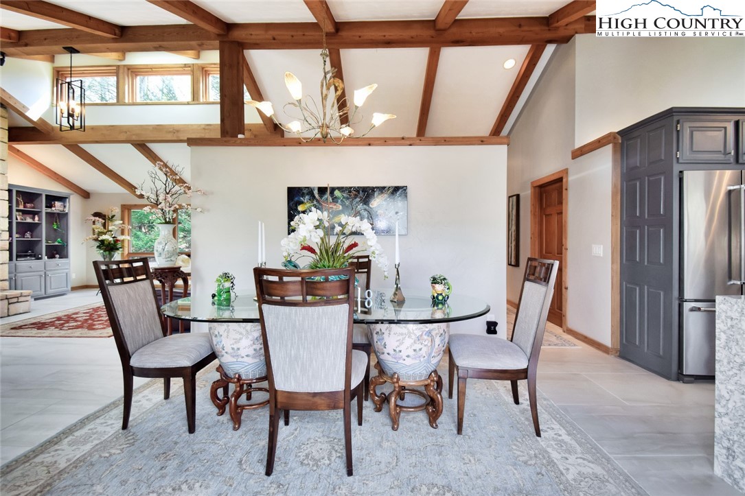 505 Tanglewood Cemetery Road Linville, NC 28646 - Photo 10 of 47 a view of a dining room with furniture window and wooden floor