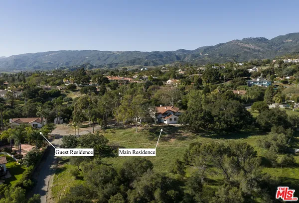 an aerial view of residential house and outdoor space