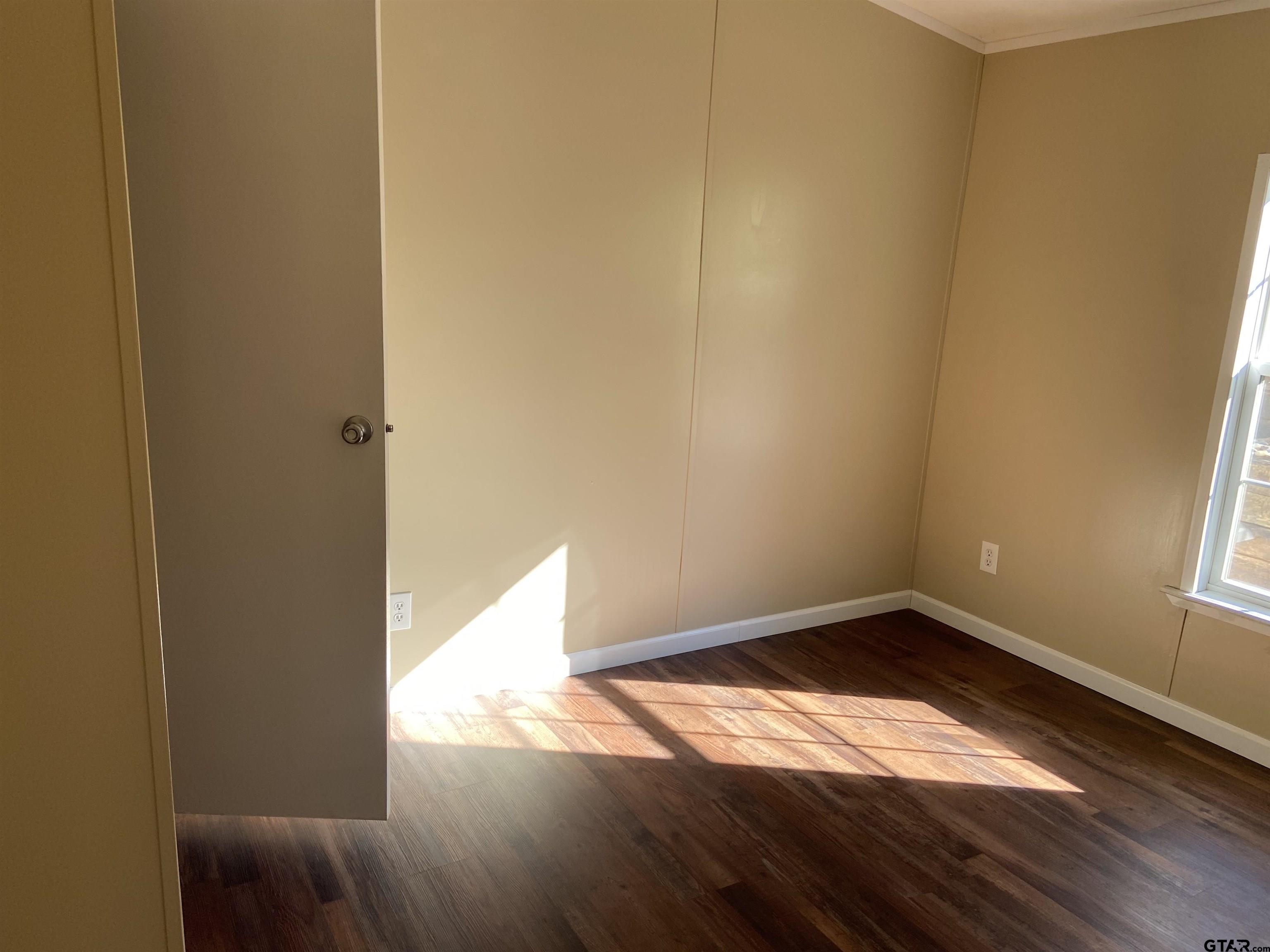 58 Florey Lake Road Kilgore, TX 75662 - Photo 9 of 14 a view of empty room with wooden floor