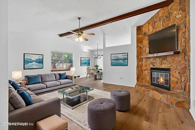 a kitchen with granite countertop a sink a counter space appliances and cabinets