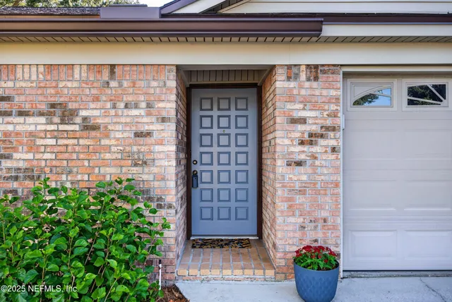 a view of a hallway with wooden floor and a fireplace