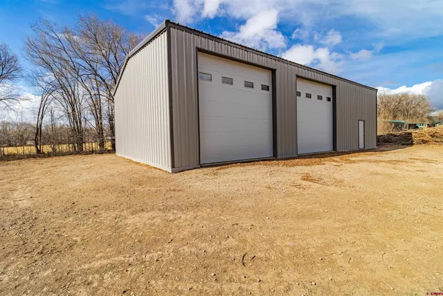 a view of a house with a snow in the yard