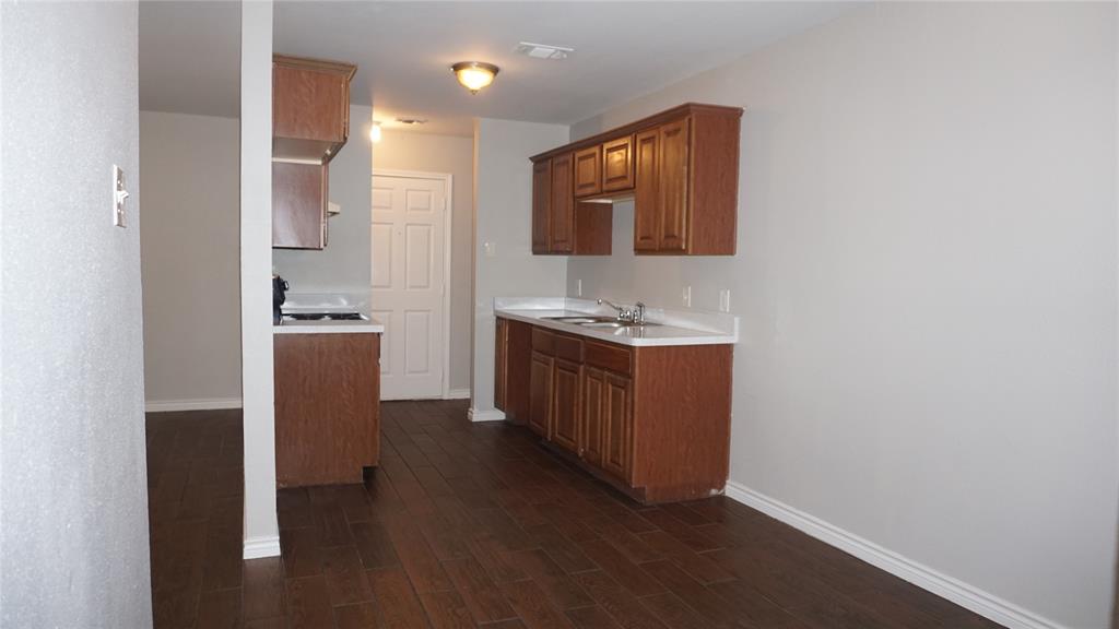 2113 R. W. Bivens Lane, Unit 2115 Fort Worth, TX 76105 - Photo 3 of 9 a bathroom with a sink and a mirror