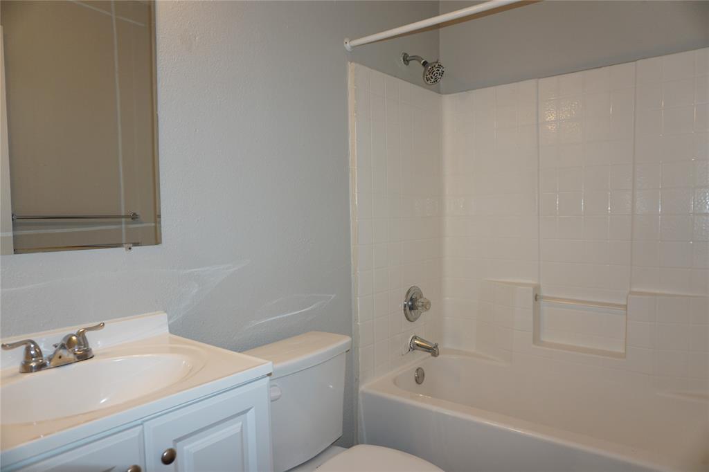 2113 R. W. Bivens Lane, Unit 2115 Fort Worth, TX 76105 - Photo 6 of 9 a bathroom with a bathtub and a sink