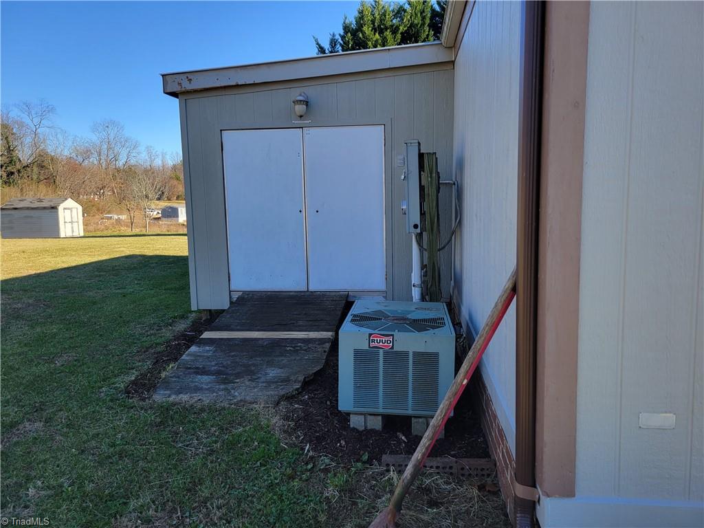 3903 Yellow Banks Road Hays, NC 28635 - Photo 22 of 24 second half of outdoor addition storage for tools and mower