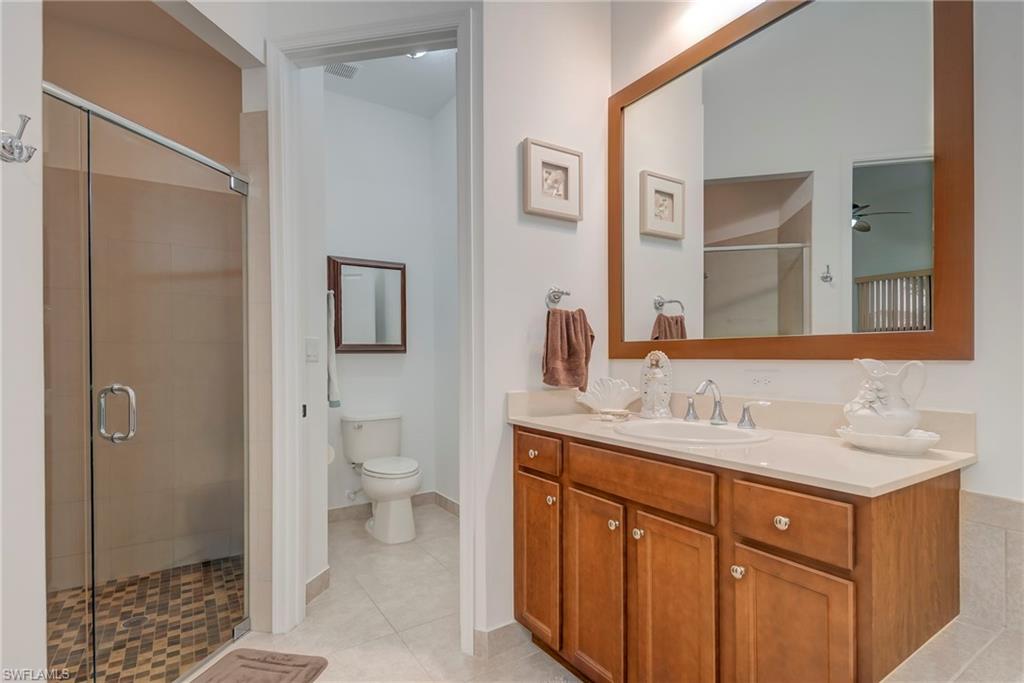 5239 Ferrari Avenue Ave Maria, FL 34142 - Photo 17 of 30 a bathroom with a sink a toilet and shower