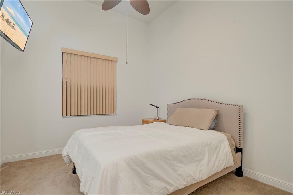5239 Ferrari Avenue Ave Maria, FL 34142 - Photo 19 of 30 a bedroom with a bed and window