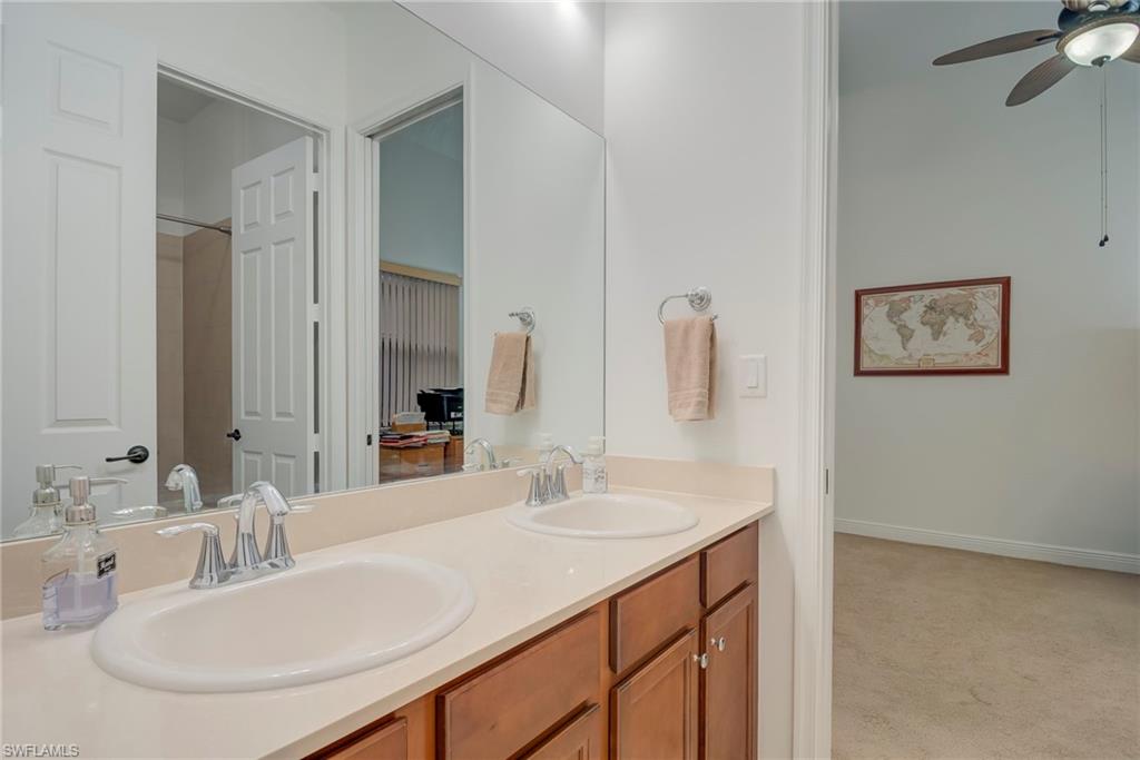 5239 Ferrari Avenue Ave Maria, FL 34142 - Photo 21 of 30 a bathroom with a sink and a mirror