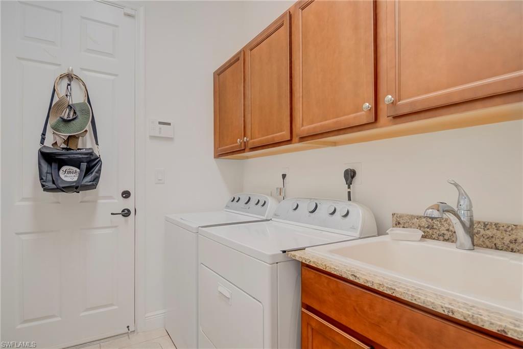 5239 Ferrari Avenue Ave Maria, FL 34142 - Photo 23 of 30 a utility room with dryer and washer