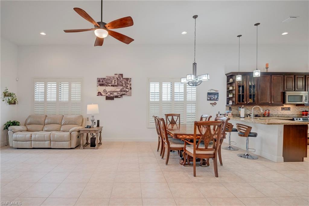 5239 Ferrari Avenue Ave Maria, FL 34142 - Photo 4 of 30 a dining room with furniture and window